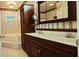 Luxurious bathroom with dual sinks, a large mirror, and a corner soaking tub for ultimate relaxation at 618 Wintercreeper Dr., Longs, SC 29568