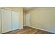 Neutral bedroom with a closet and neutral walls, and wood-look flooring at 618 Wintercreeper Dr., Longs, SC 29568