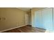 Neutral bedroom with a closet and neutral walls, and wood-look flooring at 618 Wintercreeper Dr., Longs, SC 29568