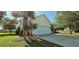 Exterior view of a home featuring a two-car garage, well-maintained lawn, and mature landscaping at 618 Wintercreeper Dr., Longs, SC 29568