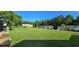 Spacious front yard with well-manicured lawn and mature trees and a beautiful view of the neighborhhod at 618 Wintercreeper Dr., Longs, SC 29568