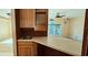 Eat-in kitchen area with seating bar and view to the bright living room at 618 Wintercreeper Dr., Longs, SC 29568