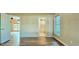 Bright main bedroom featuring beautiful hardwood floors and an ensuite bathroom for added convenience at 618 Wintercreeper Dr., Longs, SC 29568