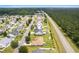 Aerial view of a beautiful home in a neighborhood setting with lush landscaping at 620 Seth Ln., Longs, SC 29568