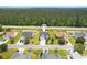 Aerial view of a well-maintained home with green lawn and proximity to green areas at 620 Seth Ln., Longs, SC 29568