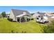 Landscaped backyard featuring a covered patio and parked recreational vehicle at 620 Seth Ln., Longs, SC 29568