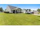Expansive backyard featuring a covered patio and an RV parked on a paved area at 620 Seth Ln., Longs, SC 29568
