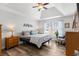 Cozy bedroom with a ceiling fan, lots of natural light, and simple decor at 620 Seth Ln., Longs, SC 29568