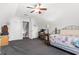Large bedroom with dormer and desk has vaulted ceilings, gray carpet and a view of the outdoors at 620 Seth Ln., Longs, SC 29568