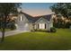 Inviting exterior showcases a well-maintained lawn, two car garage and tidy landscaping at 620 Seth Ln., Longs, SC 29568