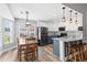 Modern kitchen with stainless steel appliances, a kitchen island, and an adjacent dining area at 620 Seth Ln., Longs, SC 29568