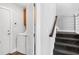 Mudroom and laundry area near carpeted stairs, with white washer and dryer visible at 620 Seth Ln., Longs, SC 29568