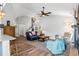 Bright living room featuring wood floors, neutral walls, modern furnishings, and a ceiling fan at 620 Seth Ln., Longs, SC 29568