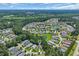 Aerial view of a community with lush landscaping, trees and small ponds at 628 Grand Cypress Way, Murrells Inlet, SC 29576