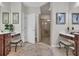 Bright bathroom featuring dual vanities, a walk-in shower, and neutral decor at 628 Grand Cypress Way, Murrells Inlet, SC 29576