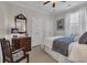 Bedroom with a dark wood dresser, chair, and neutral carpet at 628 Grand Cypress Way, Murrells Inlet, SC 29576