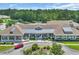 Exterior view of community clubhouse with manicured landscaping at 628 Grand Cypress Way, Murrells Inlet, SC 29576