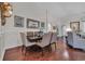 Traditional dining room with hardwood floors, wainscoting, and decorative mirror at 628 Grand Cypress Way, Murrells Inlet, SC 29576