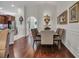 Spacious dining room with decorative lighting and easy access to kitchen and front door at 628 Grand Cypress Way, Murrells Inlet, SC 29576