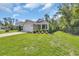 Beautifully landscaped front yard with a charming light green exterior and inviting porch at 628 Grand Cypress Way, Murrells Inlet, SC 29576