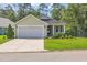 Charming single-story home with a well-manicured lawn and inviting curb appeal at 628 Grand Cypress Way, Murrells Inlet, SC 29576