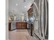 Open kitchen with stainless steel appliances and views to living area at 628 Grand Cypress Way, Murrells Inlet, SC 29576