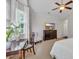 Bright main bedroom with desk area, large window, and ceiling fan at 628 Grand Cypress Way, Murrells Inlet, SC 29576
