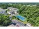 Aerial view of the condo complex, including a tennis court and parking lot at 6309 Sweetwater Blvd., Murrells Inlet, SC 29576