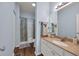 This bathroom has a large mirror, granite countertop, and full tub and shower at 6309 Sweetwater Blvd., Murrells Inlet, SC 29576
