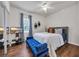 Cozy bedroom featuring hardwood floors, bed, and a blue bench at 6309 Sweetwater Blvd., Murrells Inlet, SC 29576