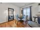 Dining room features wood floors, glass table, and stylish decor at 6309 Sweetwater Blvd., Murrells Inlet, SC 29576