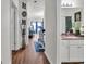 Hallway with hardwood floors with view to living room and bathroom at 6309 Sweetwater Blvd., Murrells Inlet, SC 29576