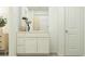 Clean bathroom featuring white cabinetry and a stylish vanity with modern finishes and decor at 6332 Swainson Street Sw, Ocean Isle Beach, NC 28469
