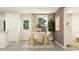 Elegant dining area with a wooden table, seating for six, and modern decor at 6347 Swainson Street Sw, Ocean Isle Beach, NC 28469