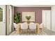 Cozy dining room with a wooden table, six white chairs, and a decorative plant at 6347 Swainson Street Sw, Ocean Isle Beach, NC 28469