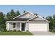 Charming single-story home with gray siding, a black front door, and a two-car garage at 6347 Swainson Street Sw, Ocean Isle Beach, NC 28469