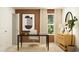 Home office featuring a minimalist desk, natural light, and decorative artwork at 6366 Swainson Street Sw, Ocean Isle Beach, NC 28469