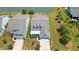 Aerial view of a house showing landscaping, lawn and proximity to neighborhood lake at 6378 Torino Lane, Myrtle Beach, SC 29572