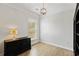 Bright bedroom with hardwood floors, natural light, and a minimalist aesthetic at 6378 Torino Lane, Myrtle Beach, SC 29572