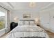 Elegant main bedroom with tray ceiling, chandelier, and tastefully coordinated decor at 6378 Torino Lane, Myrtle Beach, SC 29572