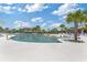 Resort-style community pool with palm trees and plenty of lounge chairs at 6378 Torino Lane, Myrtle Beach, SC 29572