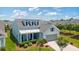 Charming home featuring dormer windows, a covered porch, and a two-car garage, set amidst a well-manicured lawn at 6378 Torino Lane, Myrtle Beach, SC 29572
