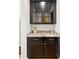 Close up on kitchen area featuring granite countertops and dark wood cabinets at 6378 Torino Lane, Myrtle Beach, SC 29572