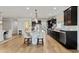 Spacious kitchen featuring dark wood cabinets, stainless appliances, and modern pendant lighting at 6378 Torino Lane, Myrtle Beach, SC 29572