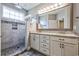 Bathroom featuring double vanity, granite countertop and a luxurious walk-in shower at 648 Sunnyside Dr. # 102, Murrells Inlet, SC 29576