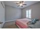 Comfortable bedroom with a window, ceiling fan and a closet for ample storage at 648 Sunnyside Dr. # 102, Murrells Inlet, SC 29576