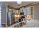 Kitchen featuring granite counters, stainless appliances, stylish cabinets, and a breakfast bar at 648 Sunnyside Dr. # 102, Murrells Inlet, SC 29576