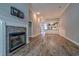 Open-concept living area with a fireplace and views of the kitchen and dining space at 648 Sunnyside Dr. # 102, Murrells Inlet, SC 29576