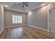 Spacious main bedroom with tray ceilings, fan, window and an ensuite bathroom at 648 Sunnyside Dr. # 102, Murrells Inlet, SC 29576
