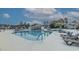 Inviting community pool with lounge chairs and a covered pavilion for relaxation at 648 Sunnyside Dr. # 102, Murrells Inlet, SC 29576